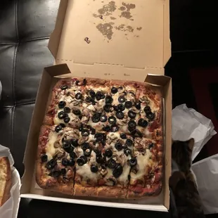 Charge me four dollars for black olives and can&apos;t even put them on all of the pieces