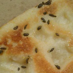 I ordered cheese pizza and this is what i got. RAT FECES in it.. Kawal the owner was very vulgur. Not fair!!