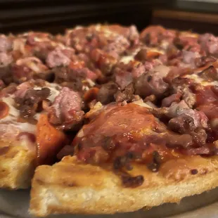Meat lovers pizza with thick crust