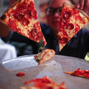 a slice of pepperoni pizza