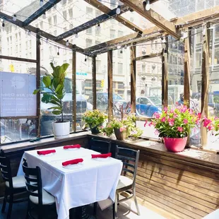 a patio with tables and chairs