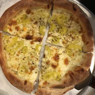 a sliced pizza on a plate