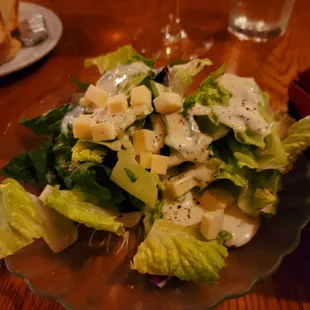 a salad with cheese and lettuce