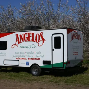 a food truck parked in a field