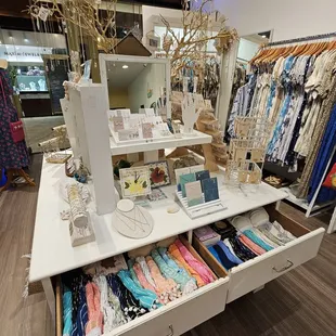 Scarves/wraps, dresses, and jewelry