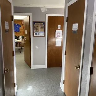 There are two showers on each side of the hall leading back out to the office/store and craft/hobby area