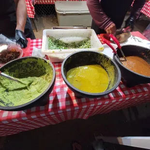 three bowls of food on a table