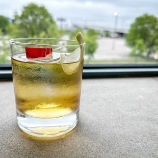 Rising sun cocktail with view out the bar window