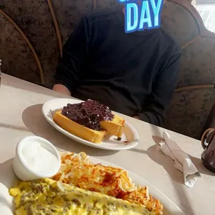 French toast with blueberry toppings, gyro omelette, hash browns