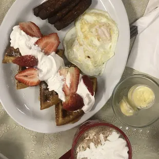 Angel&apos;s: Belgian waffles with eggs over medium sausage and Mexican chocolate