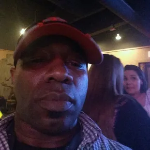 a man wearing a red hat