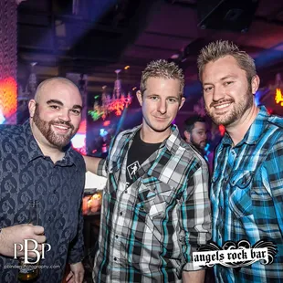 three men posing for a picture