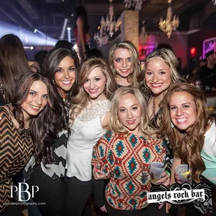 a group of women posing for a picture