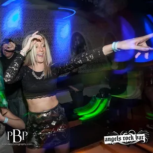 a woman dancing with her arms outstretched