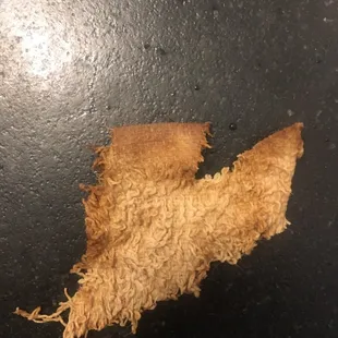 This piece of a dish rag was in my beef burrito.