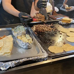a woman making tortillas
