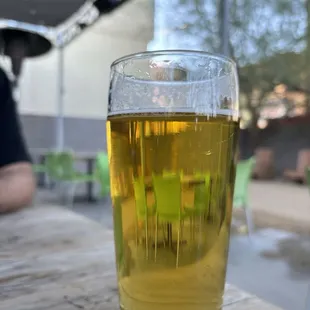 a glass of beer on a table