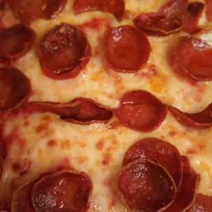 a pepperoni pizza in a box