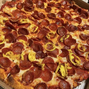 a pepperoni pizza in a box