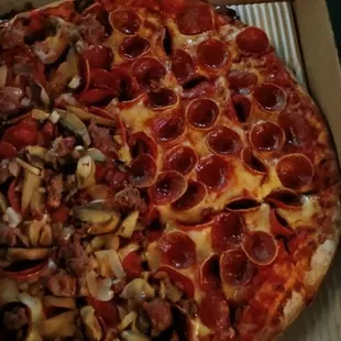 A medium pizza with half pepperoni and cheese and an Ange's Combo but minus the green peppers.