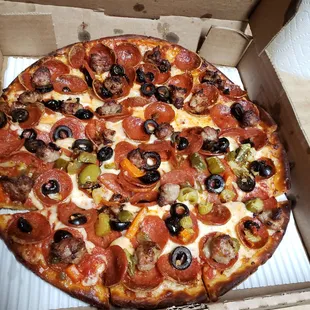 Pepperoni, Black Olives, Sausage and Giardino on half- well done