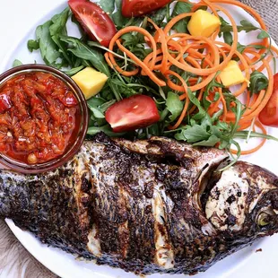 a plate of fish and vegetables