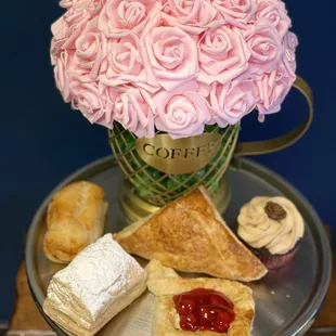 a cup of coffee and pastries