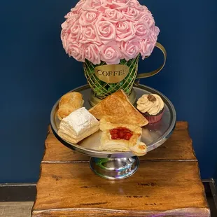 a tray of pastries and flowers
