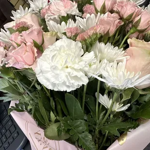 Pink roses and white flowers.