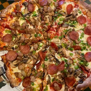 Deluxe pizza (sausage only on half as we ordered)