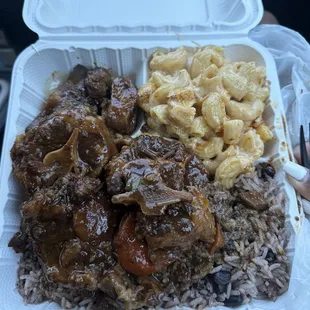 Oxtail with rice and peas and Mac and Cheese