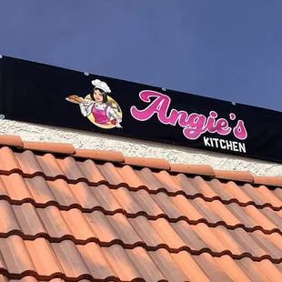 The shop sign outside.