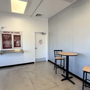 a table and two chairs in a room