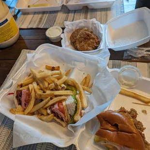 Half a club sandwich and half-ish a fried chicken sandwich. Background: fried green tomatoes