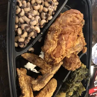 Fried chicken, collard greens, and pinto beans
