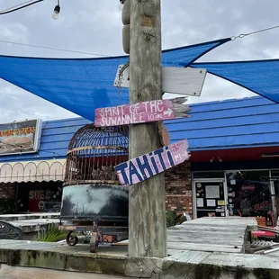a pole with signs on it