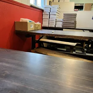a table with pizza boxes on it