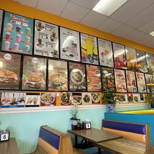 Restaurant seating, menu covers all the walls.