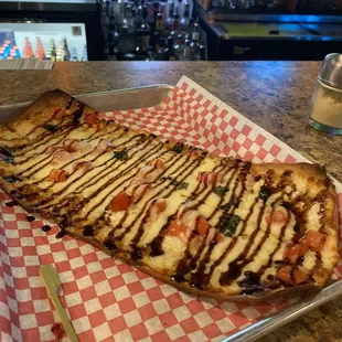 Margarita Flat Bread Pizza with Balsamic vinaigrette drizzle.