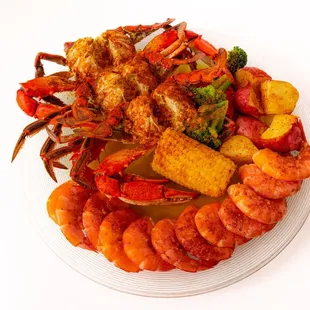 a plate of seafood and vegetables