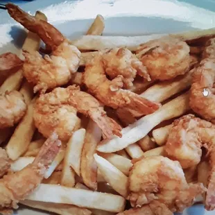 a plate of fried shrimp and french fries