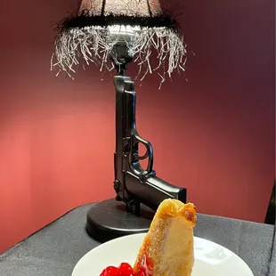 a piece of cake on a plate with a knife and fork