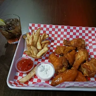 Buffalo wings, French fries, and a Jack &amp; Coke.