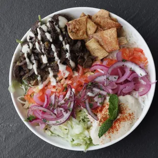 Steak Shawarma Bowl with Tahini Sauce on top!