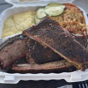 My sons juicy as fuck brisket, ribs, Tomato pie that's TO DIE FOR!! and cheesy pepper grits...