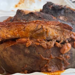 Rib on a loaded baked potato.