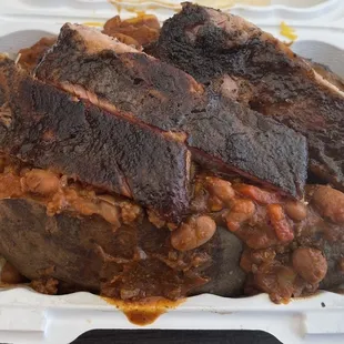 Loaded baked potato with ribs.