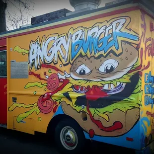 a food truck with graffiti on it