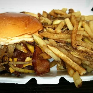 What an Angry Burger looks like! This is a double with Bacon, American Cheese, Charmed Onions, and BBQ Sauce on a Brioche bun.