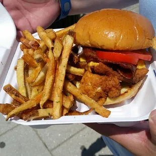 Buttermilk fried chicken with bacon and American cheese, lettuce, tomato and regular fries